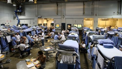 Inmates at the Mule Creek State Prison interact in a gymnasium that was modified to house prisoners in Ione, California. Prisoners in at least 17 states plan to begin a strike Tuesday, protesting low prisoner wages and poor conditions.