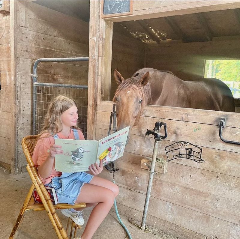 'Read to the Rescues' is a popular event for all ages at Zorro's Crossing Horse Sanctuary. Photo courtesy of Zorro's Crossing.