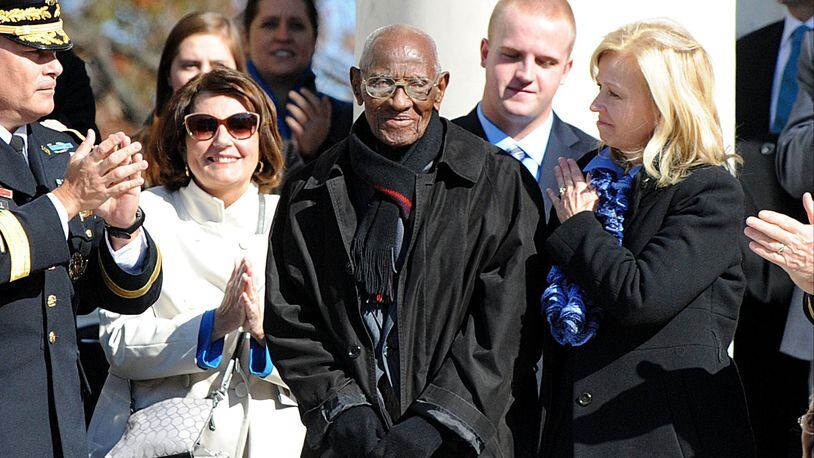 Richard Overton, center, was honored at Arlington National Cemetery by President Barack Obama in 2013.