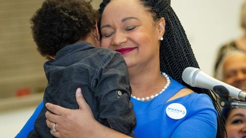 Georgia State Senator Nikema Williams (Democrat - 39 holds her son Carter Small after Williams gave her speech for the Democratic Party of Georgia Chair position at the 2019 Georgia Democratic Party State Convention in Atlanta GA January 26, 2019.  STEVE SCHAEFER / SPECIAL TO THE AJC