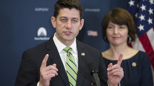 U.S. House Speaker Paul Ryan of Wisconsin, accompanied by U.S. Rep. Cathy McMorris Rodgers, R-Wash., speaks to reporters on Capitol Hill in Washington, following a Republican Caucus meeting. (AP Photo/Cliff Owen)