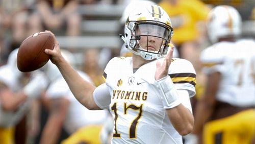 Quarterback Josh Allen of the Wyoming Cowboys warms up before the matchup against the Iowa Hawkeyes, on September 2, 2017 at Kinnick Stadium in Iowa City, Iowa. (Photo by Matthew Holst/Getty Images)