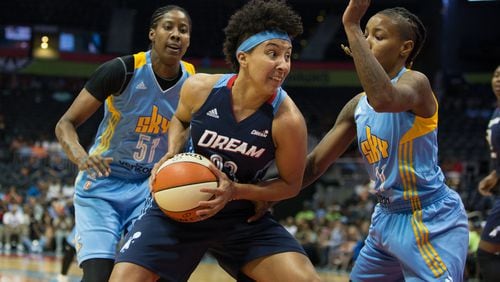 Atlanta Dream guard Layshia Clarendon (23) drives the ball to the basket while being defended by Chicago Sky guard Jamierra Faulkner (21), right, and Chicago Sky forward Jessica Breland (51) during a game between the Atlanta Dream and Chicago Sky at Phillips Arena, Sunday, May 22, 2016, in Atlanta. The Atlanta Dream defeated Chicago Sky 87-81. BRANDEN CAMP/SPECIAL