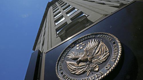 The seal affixed to the front of the Department of Veterans Affairs building in Washington. Some 20 veterans commit suicide each day and the VA has struggled to curb the crisis. (AP Photo/Charles Dharapak, File)