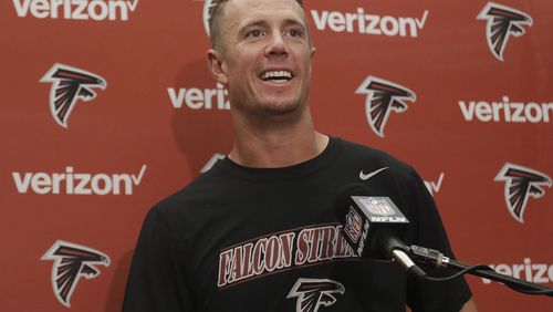 Falcons quarterback Matt Ryan, who was all smiles after Sunday's win, has thrown for 730 yards and leads the NFL in quarterback efficiency rating. (AP photo)