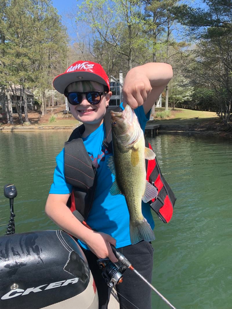 Tom More Smith’s grandson, Will, is proud of his catch, a two-pound largemouth bass. 
Courtesy of Tom More Smith.