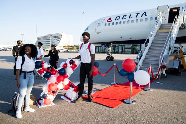 Participants of Delta’s Dream Flight 2022 event pose for a photo before boarding a plane at Hartsfield-Jackson Atlanta International Airport on Friday, July 15, 2022. Around 150 students ranging from 13 to 18 years old will fly from Atlanta to the Duluth Air National Guard Base in Duluth, Minnesota. (Chris Day/Christopher.Day@ajc.com)