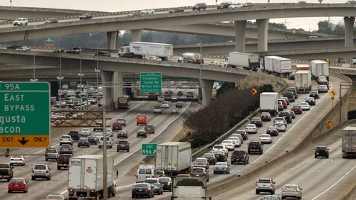 Automobiles travel through Spaghetti Junction, with some stacking up on the I-285 East ramp on a typical day. DeKalb County and metro Atlanta as a whole are projected to continue growing over the next 25 years. JASON GETZ / JGETZ@AJC.COM