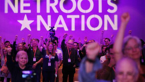 Attendees cheer speakers during an event at the Netroots Nation conference. Nearly 3,000 liberal activists from across the nation have come to Atlanta for the conference. Curtis Compton/ccompton@ajc.com