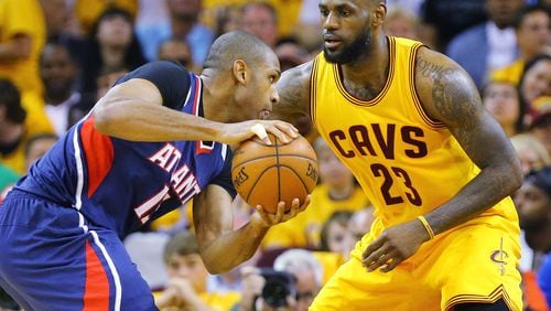 Hawks’ Al Horford looks to drive against Cavaliers’ LeBron James in the Eastern Conference Finals Game 3 on Sunday, May 24, 2015, in Cleveland. Curtis Compton / ccompton@ajc.com