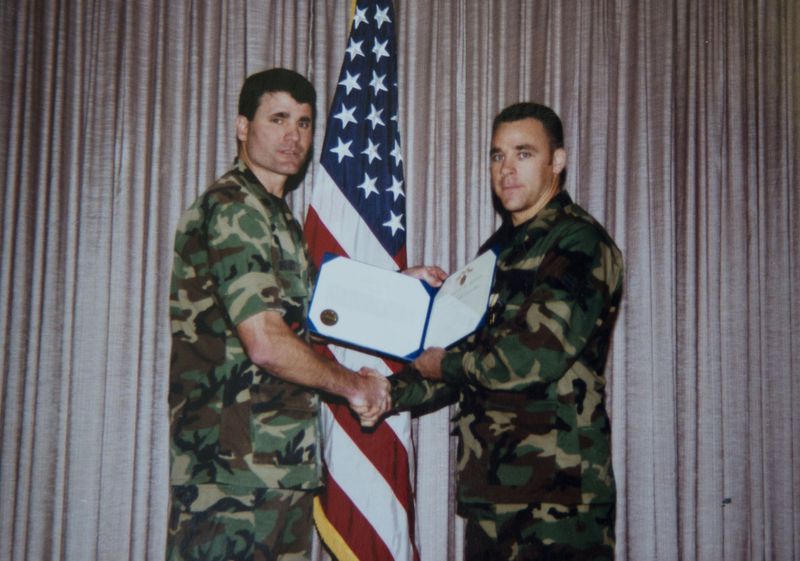 In an awards ceremony in June 1999, Tyler Bowser (right) received an Air Force Commendation Medal for an act of heroism that saved nine airmen’s lives. He received it from Lt. Col. Dan Wiley. CONTRIBUTED BY TYLER BOWSER