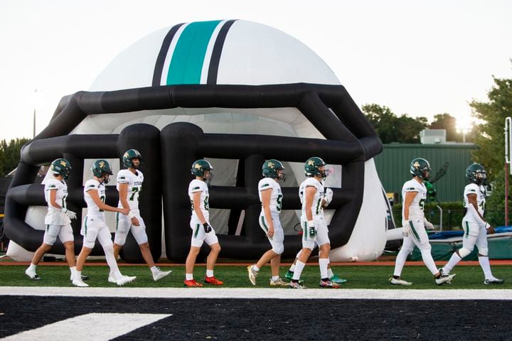 Blessed Trinity takes the field before the Blessed Trinity vs. Roswell high school football game on Thursday, September 29, 2022, at Roswell high school in Roswell, Georgia. Roswell defeated Blessed Trinity 41-10. CHRISTINA MATACOTTA FOR THE ATLANTA JOURNAL-CONSTITUTION.
