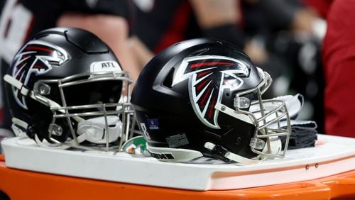 Atlanta Falcons helmets are shown during the second half against the New Orleans Saints at Mercedes-Benz Stadium, Sunday, January 9, 2022, in Atlanta. The Falcons lost to the Saints 30-20. JASON GETZ FOR THE ATLANTA JOURNAL-CONSTITUTION