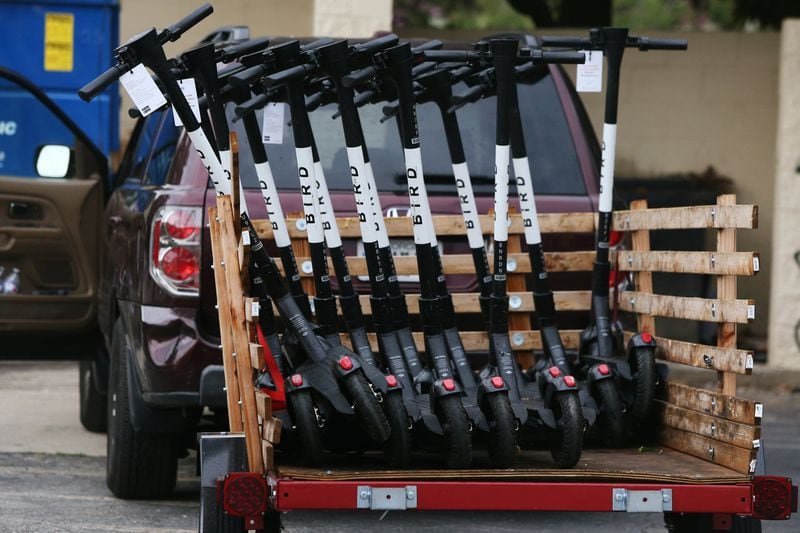 Bird scooters sit on a trailer, ready for distribution along the Atlanta BeltLine and in Piedmont Park in July. Many Atlantans have embraced e-scooters, while others complain that they violate pedestrians’ right of way. Atlanta City Council approved regulations on the scooters at the beginning of 2019, requiring companies to prevent them from being scattered haphazardly on city sidewalks. 