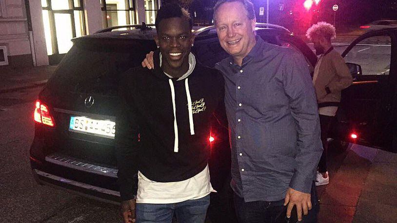 Hawks point guard Dennis Schroder posted this photo with coach Mike Budenholzer from Germany on Thursday.
