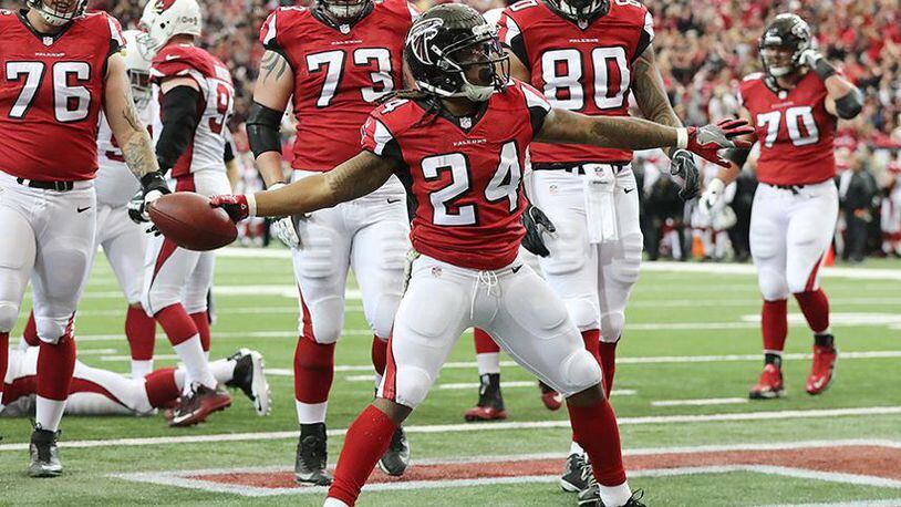 Falcons running back Devonta Freeman spikes the ball after scoring a touchdown against the Arizona Cardinals to tie the game 7-7 during the first quarter Sunday, Nov. 27, 2016, at the Georgia Dome in Atlanta. (Curtis Compton/ccompton@ajc.com)