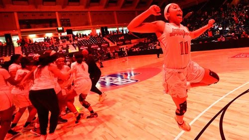 Greater Atlanta Christian star Ava Irvin leaps in the air as the lights turn red when time expires in a 54-44 victory over Beach to win the Class 3A state basketball championship Thursday, March 5, 2020, in Macon.  (Curtis Compton ccompton@ajc.com)