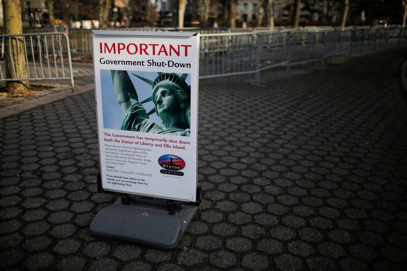 A shutdown placard is seen at the entrance of the Liberty State ferry terminal in Battery Park in New York.