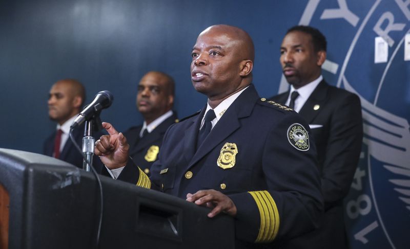 March 15, 2022 Atlanta: Atlanta police chief Rodney Bryant speaks at the podium as police command staff (left to right) Lt. Ralph Woolfolk, commander of Atlanta police's homicide unit, Deputy Chief Charles Hampton and Mayor Andre Dickens spoke about how Atlanta’s homicide detectives have made arrests in 72% of this year’s killings on Tuesday, March 15, 2022. (John Spink / John.Spink@ajc.com)

