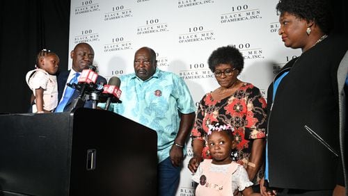 Marvin Grier (center), father of Brianna Grier, gets emotional as he speaks to members of the press during a news conference Wednesday at Clark Atlanta University’s Henderson Student Center in Atlanta. He was joined by civil rights attorney Ben Crump (left), Georgia gubernatorial candidate Stacey Abrams (right) and other members of the Grier family to discuss what Abrams is calling Georgia's mental health crisis.