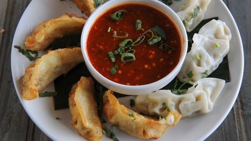 Momo - steamed and/or fried dumplings stuffed with choice of vegetables or chicken -- at Masti. / AJC file photo
