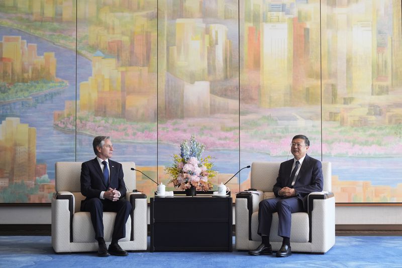U.S. Secretary of State Antony Blinken, left, talks with Shanghai Party Secretary Chen Jining at the Grand Halls, Thursday, April 25, 2024, in Shanghai, China. (AP Photo/Mark Schiefelbein, Pool)