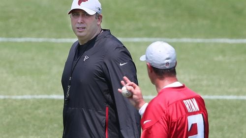 Falcons head coach Arthur Smith (left) speaks with quarterback Matt Ryan during organize team activities (OTAs) Tuesday, May 25, 2021, at the team training facility in Flowery Branch. (Curtis Compton / Curtis.Compton@ajc.com)