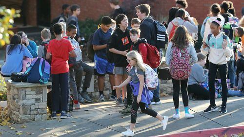 In this file photo, school gets out at Mabry Middle School in Cobb County where an unvaccinated was diagnosed with measles. Curtis Compton/ccompton@ajc.com