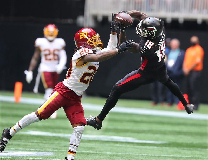 Washington Football Team safety Bobby McCain breaks up a pass to Falcons wide receiver Calvin Ridley during the fourth quarter Sunday, Oct. 3, 2021, at Mercedes-Benz Stadium in Atlanta. (Curtis Compton / Curtis.Compton@ajc.com)