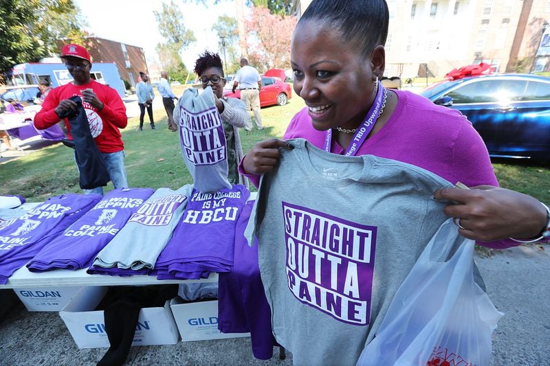 Ms. Chellita Carlyle buys a Straight Outta Paine shirt during a college spirit event on the campus at Paine College on Wednesday, Nov. 1, 2017, in Augusta. (Curtis Compton / ccompton@ajc.com)