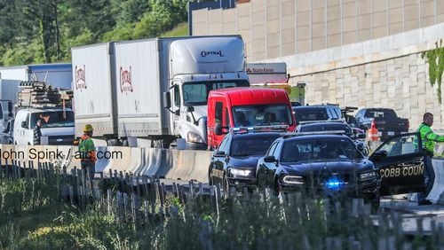 Cobb County police shut down the northbound lanes of I-75 south of Barrett Parkway while they investigated a fatal crash.