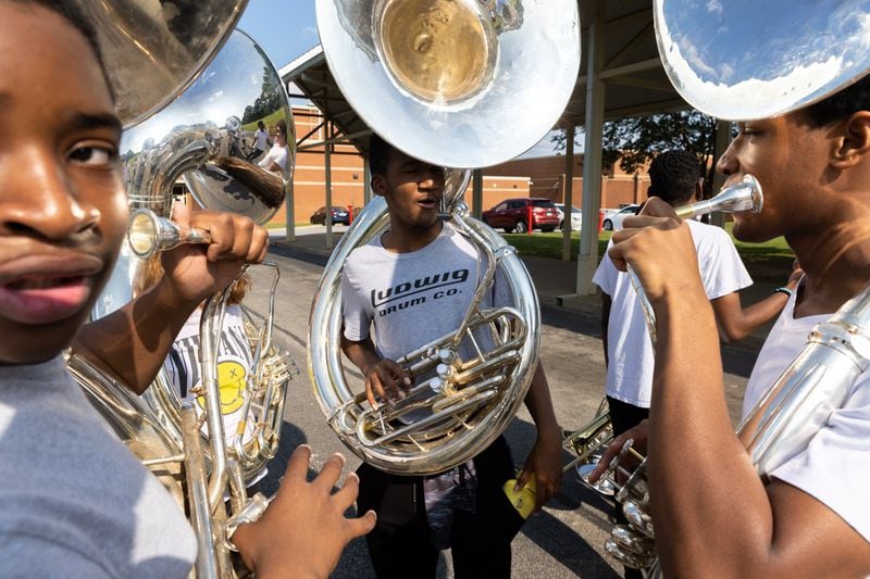 The Sound of Dutchtown high school marching band practices at Dutchtown High School in Hampton on Thursday, May 25, 2023. The band will play at a D-Day commemoration ceremony in France. (Arvin Temkar / arvin.temkar@ajc.com)