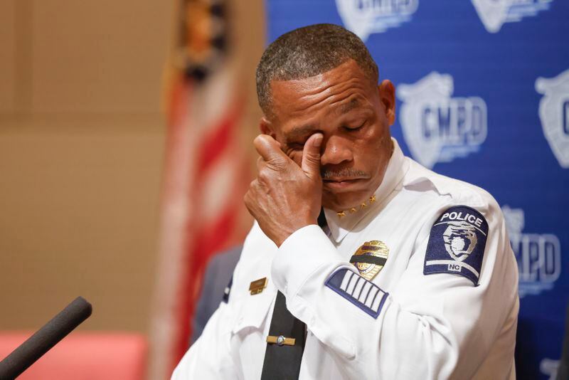 Charlotte-Mecklenburg Police Chief Johnny Jennings wipes away tears as he speaks at a press conference in Charlotte, N.C., Tuesday, April 30, 2024, regarding the shooting that killed four officers during an attempt to serve a warrant on April 29. (AP Photo/Nell Redmond)
