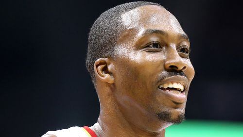 October 27, 2016 ATLANTA: Hawks Dwight Howard flashes a smile at his bench during the second period against the Wizards in the home opener of their NBA basketball game at Philips Arena on Thursday, Oct. 27, 2016, in Atlanta. Curtis Compton /ccompton@ajc.com