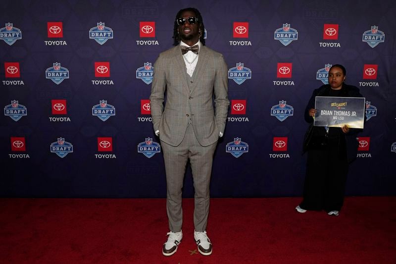 LSU wide receiver Brian Thomas Jr. poses on the red carpet ahead of the first round of the NFL football draft, Thursday, April 25, 2024, in Detroit. (AP Photo/Carlos Osorio)