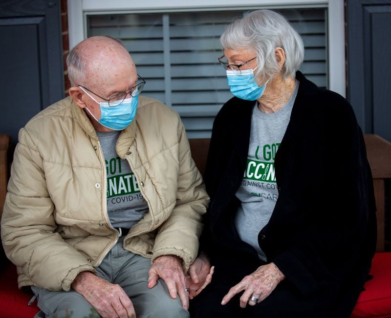 An image of Easton and Lila Wall sitting on the porch and talking about the first day they met back in college. The couple has stay quarantined at their cottage located at Belmont Village Senior Living Johns Creek since March 2020. STEVE SCHAEFER FOR THE ATLANTA JOURNAL-CONSTITUTION