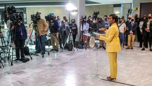 May 7, 2021 Atlanta:  Atlanta Mayor Keisha Lance-Bottoms held a press conference Friday, May 7, 2021 at Atlanta City Hall speaking about her decision not to run for a second term. In her first public appearance since announcing her decision to supporters Thursday night, Bottoms said her decision was guided by faith. “In the same way that it was very clear to me almost five years ago that I should run for mayor of Atlanta, it is abundantly clear to me today that it is time to pass the baton on to someone else,” Bottoms said at an emotional news conference at City Hall. She added that “the last three years have not been at all what I would have scripted for our city,” referencing a crippling cyber attack, a widening federal corruption investigation into the previous administration, the COVID-19 pandemic and civil unrest last year. Bottoms said she doesn’t know what’s next for her; she denied rumors that she or her husband Derek have taken jobs for Walgreens out of state. “I can’t get Derek to move two miles off Cascade Road,” she said. Bottoms, who was seen as a strong incumbent candidate despite a spike in violent crime, told friends and supporters Thursday evening she won’t seek a second term. She released a video and statement online a few hours later elaborating on her decision and reflecting on her time in office. “This is not something I woke up and decided yesterday,” Bottoms said Friday. “This is something I’ve been thinking about for a very long time.” (John Spink / John.Spink@ajc.com)