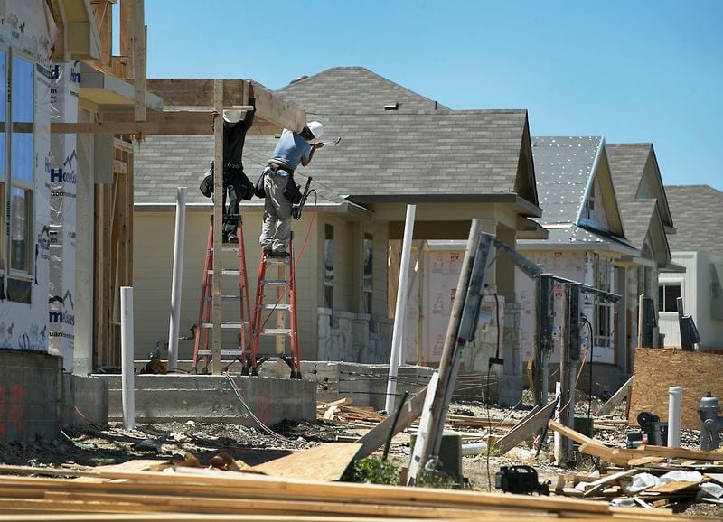 Framers work on a new home being built by Pacesetter Homes in Leander, Texas. RALPH BARRERA/AMERICAN-STATESMAN