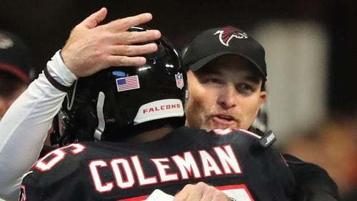 November 26, 2017 Atlanta: Falcons head coach Dan Quinn gives running back Tevin Coleman a hug after his first of two touchdown runs against the Buccaneers during the second half on the way to a 34-20 victory in a NFL football game on Sunday, November 26, 2017, in Atlanta.   Curtis Compton/ccompton@ajc.com