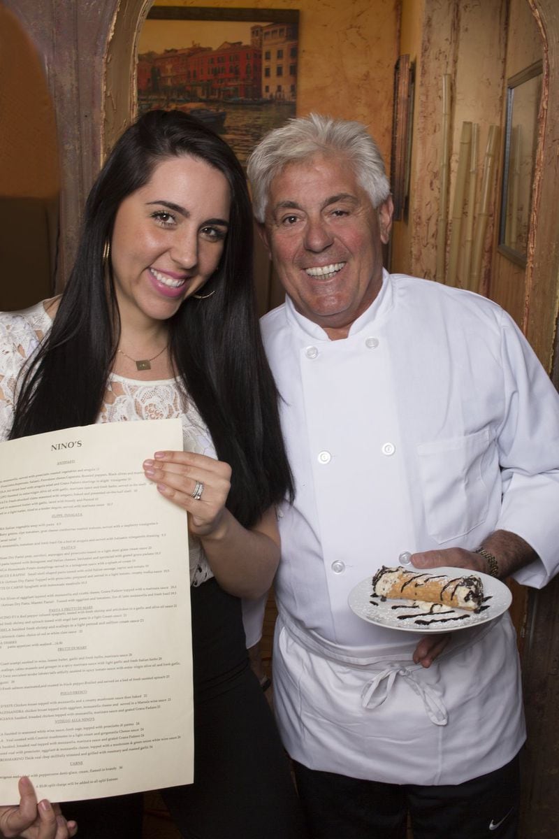 Nino’s Cucina Italiana owner Tony Noviello poses with his daughter, Alessandra Noviello Hayes, during the restaurant’s 50th anniversary dinner earlier this year. Hayes took over the family business after her dad retired. Photo: Moye Colquitt
