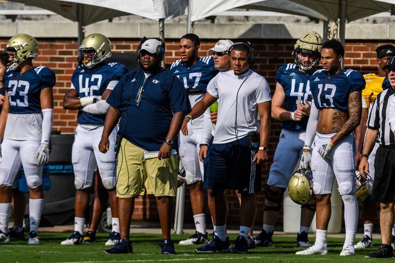 Georgia Tech student assistant A.J. Gray (white t-shirt) said that "I understand what coaches see that players don't see" in his time helping out the coaching staff. (Danny Karnik/GT Athletics)