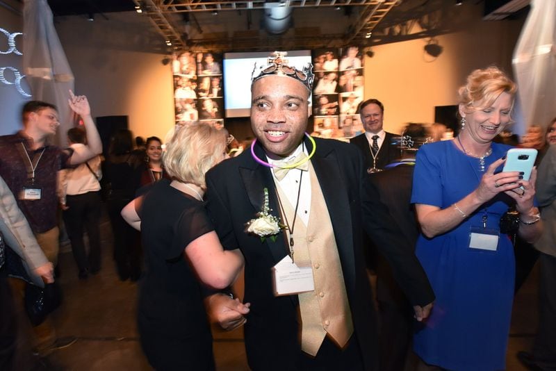 Kelvin Gillespie and his volunteer buddy Becall Johns (left) dance during the “Night to Shine” event on Feb. 8 at First Baptist Church Atlanta in Dunwoody. The event, which provides a prom night experience for people with special needs, is sponsored by the Tim Tebow Foundation and happens in all 50 states and 16 countries. HYOSUB SHIN / HSHIN@AJC.COM