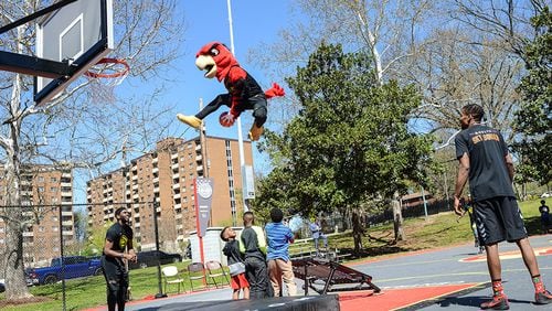 The Atlanta Hawks mascot wows the crowd at the ribbon-cutting ceremony for the newly renovated basketball court at Central Park in Atlanta’s Old Fourth Ward. Kat Goduco for the Atlanta Hawks