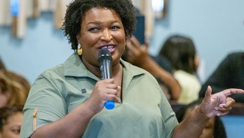 Democratic candidate for Georgia governor Stacy Abrams talks to a crowd during a campaign stop at the Two Eggs restaurant in McDonough Saturday, July 9, 2022. (Steve Schaefer / steve.schaefer@ajc.com)
