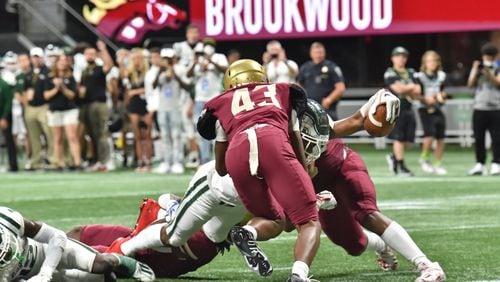 August 21, 2021 Atlanta - Collins HillÕs Richard Ransom (14) dives into the end zone for a touchdown during the 2021 Corky Kell Classic on Saturday, August 21, 2021. (Hyosub Shin / Hyosub.Shin@ajc.com)