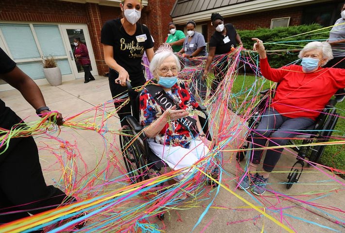 Photos: COVID-19 survivor celebrates 100th birthday
