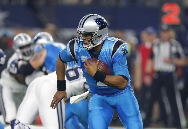 Carolina Panthers quarterback Cam Newton (1) runs the ball under pressure from the Dallas Cowboys during a NFL football game, Thursday, Nov. 26, 2015, in Arlington, Texas. (AP Photo/Brandon Wade)