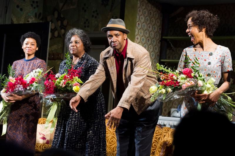 Anika Noni Rose, from left, LaTanya Richardson, Denzel Washington and Sophie Okonedo appear at the curtain call for the opening night of "A Raisin In The Sun" on Thursday, April 3, 2014 in New York. (Photo by Charles Sykes/Invision/AP)