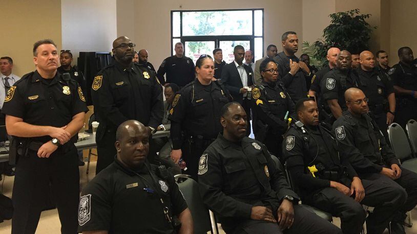 About 50 police officers watched as the DeKalb County Board of Commissioners rejected pay raises Tuesday. MARK NIESSE / MARK.NIESSE@AJC.COM