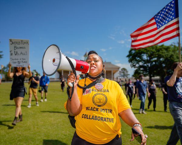 Shenita Binns with the NAACP leads protesters in chants at Stone Mountain Park on Saturday, April 30, 2022, as the Sons of Confederate Veterans members gathered. (Photo: Ben Hendren for The Atlanta Journal Constitution)